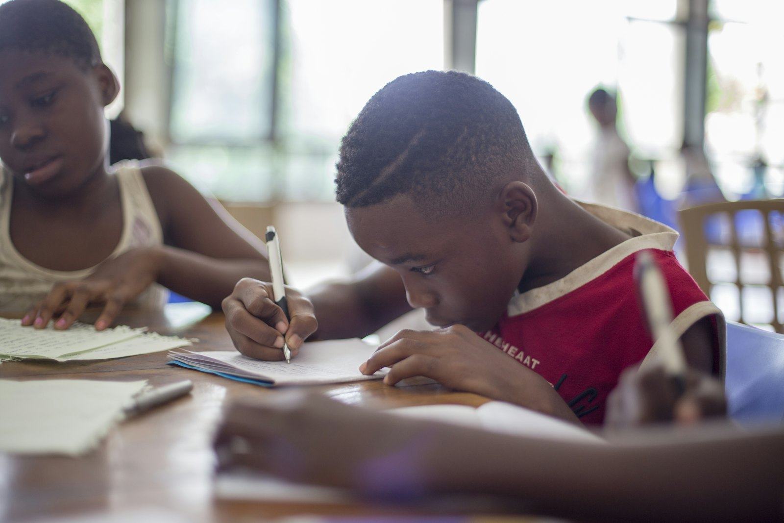 Children writing in their notebooks